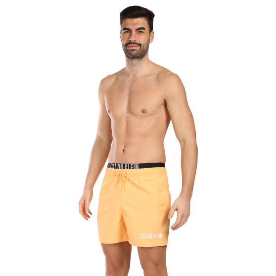 Ανδρικά μαγιό Calvin Klein πορτοκαλί (KM0KM00992-SAN)