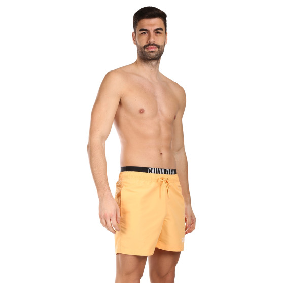 Ανδρικά μαγιό Calvin Klein πορτοκαλί (KM0KM00992-SAN)