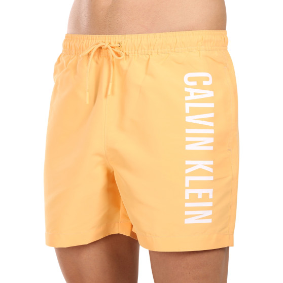 Ανδρικά μαγιό Calvin Klein πορτοκαλί (KM0KM01004-SAN)